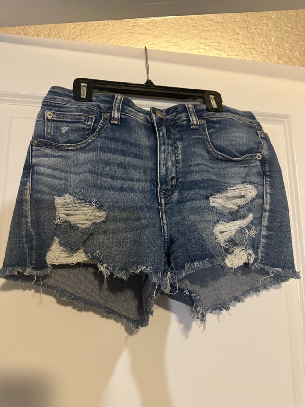 American Eagle Next Level Stretch Denim Midi Shorts Distressed Medium Wash